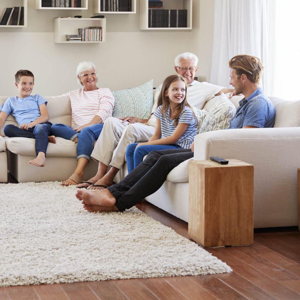 Family enjoying in living room | Tom January Floors