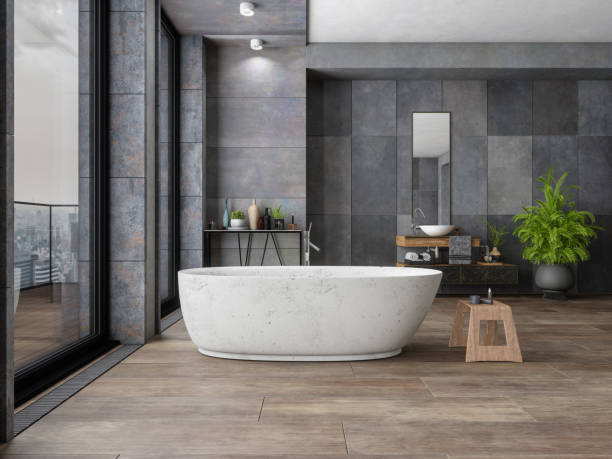 Bathroom tile dark flooring with bath tub | Tom January Floors