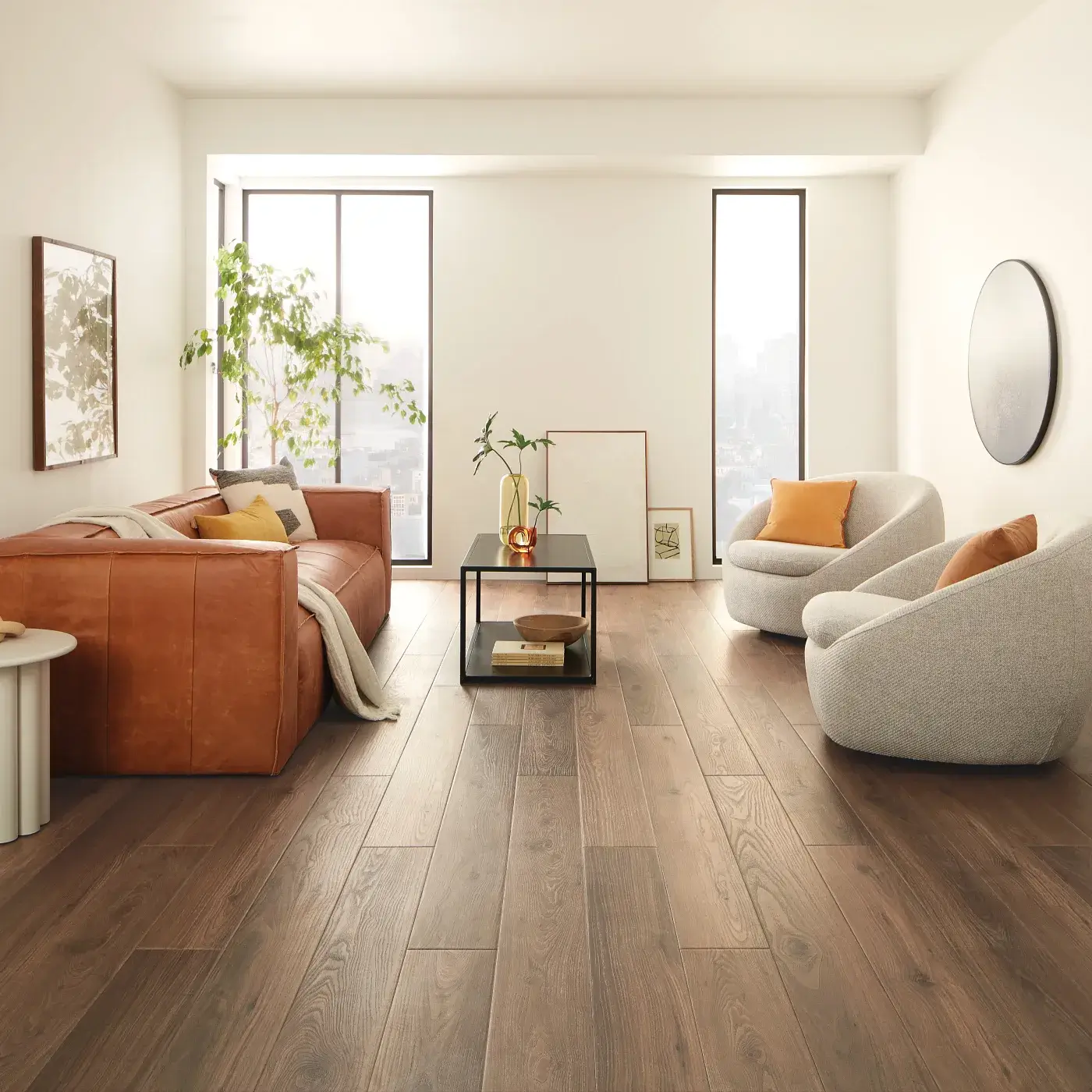 VV735_03018_ROOM COREtec Luxury Vinyl in a dark brown wood tone in a bright living room | Tom January Floors